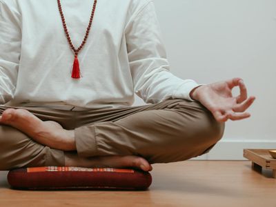 Close-up of hands in a stable yoga mudra, showing concentration.
