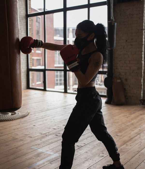 Person in a focused state during a floor exercise, showing concentration and poise.